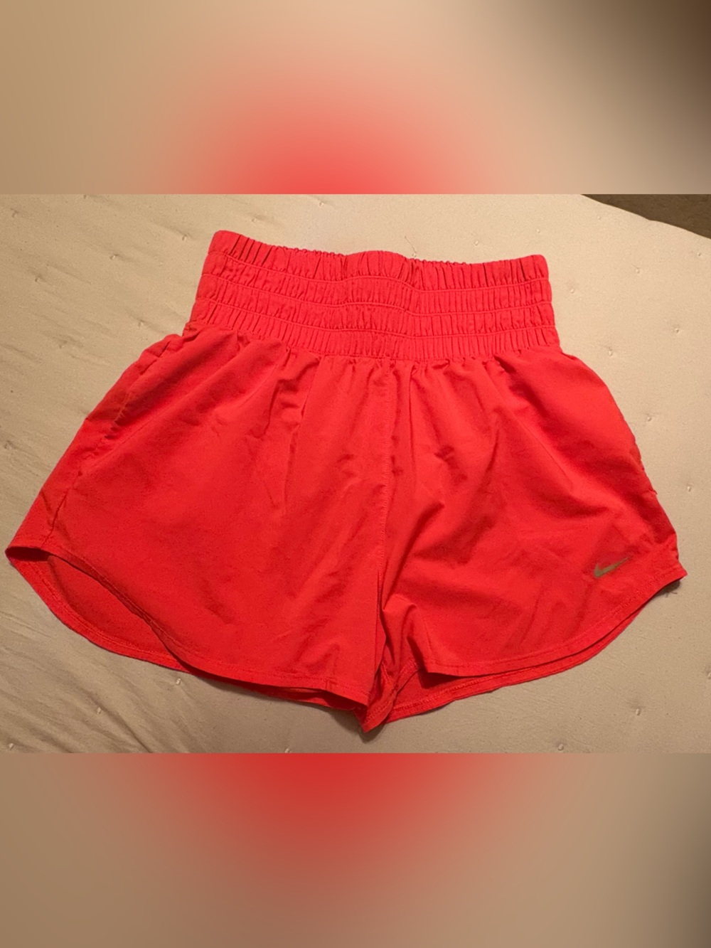 Nike Women’s coral High-Waist Running Shorts with pockets